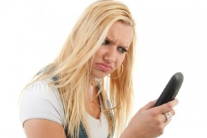 Angry Woman Looking at Phone